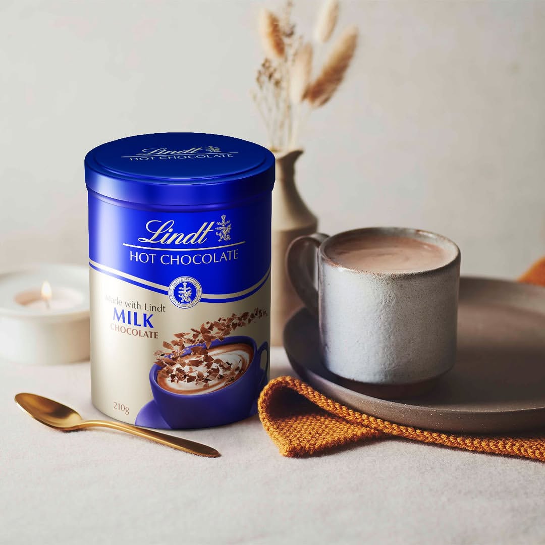 Hot choccy season is well and truly upon us! 🍫❄️ Tag someone you’d be willing to share a cup of Lindt Hot Chocolate Milk Chocolate Flakes 210g - Image 1