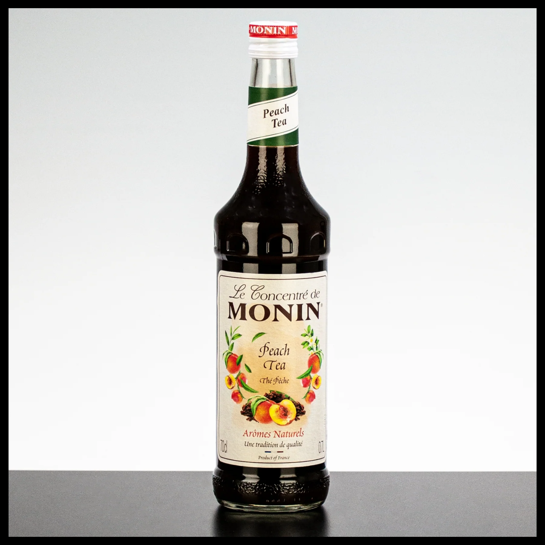 Monin Peach Tea Syrup, 1L, syrup with refreshing peach tea flavor. Monin Peach Tea Syrup 700ml - Image 1
